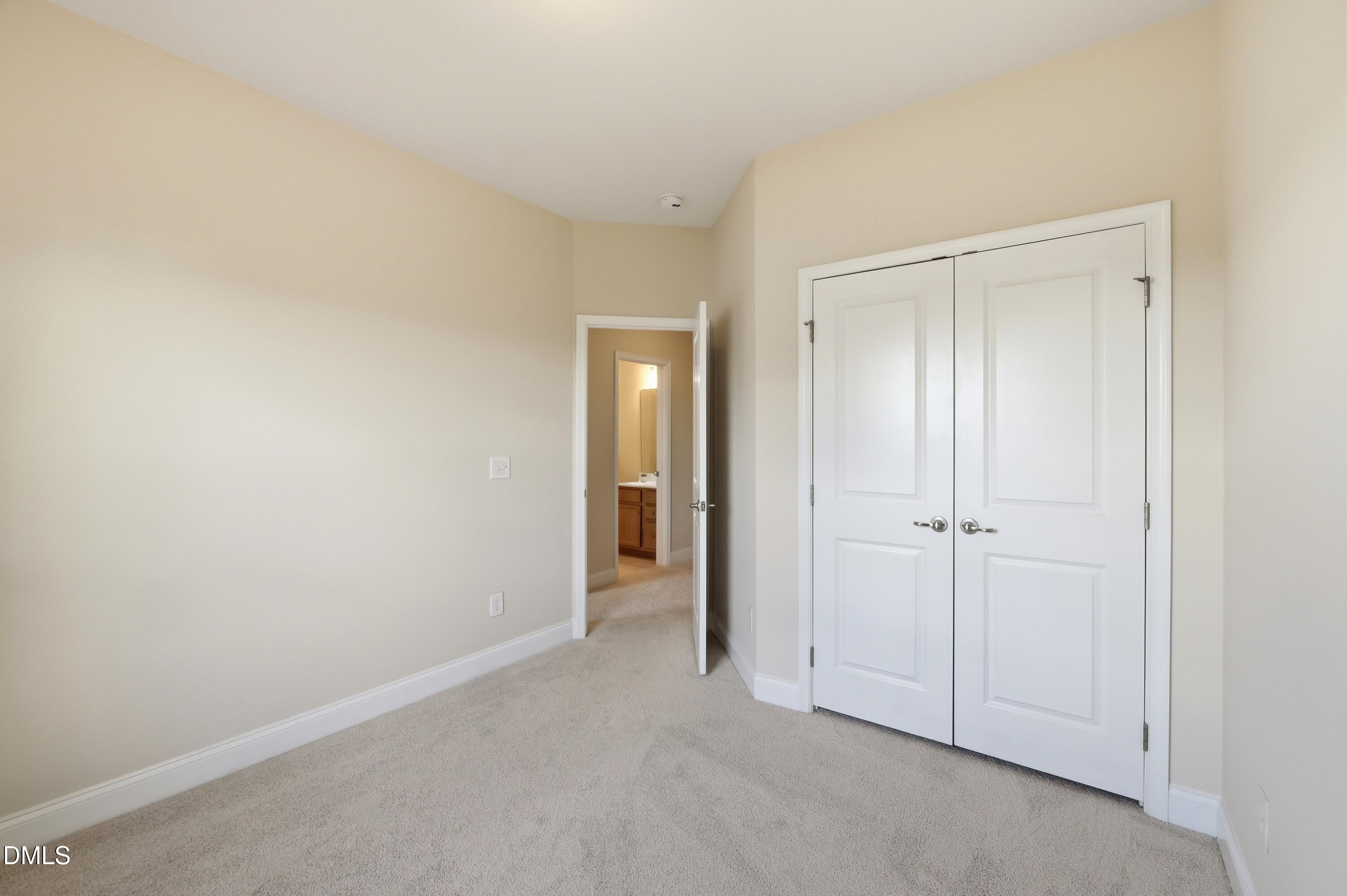 1004 Waymaker Court Apex, NC 27502 - Photo 23 of 30 a view of an empty room and closet area