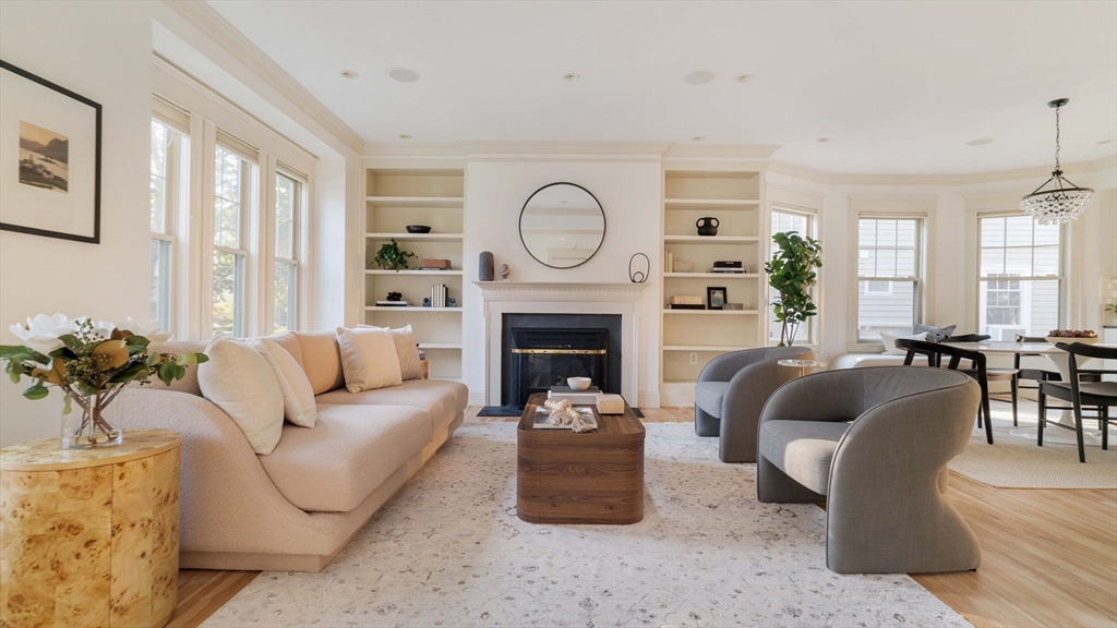54 Orchard Street, Unit 1 Boston, MA 02130 - Photo 1 of 36 a living room with furniture and a fireplace