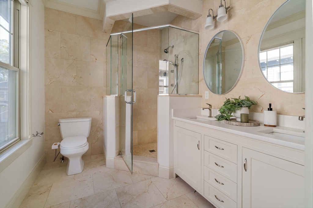 54 Orchard Street, Unit 1 Boston, MA 02130 - Photo 15 of 36 a bathroom with a toilet sink and mirror