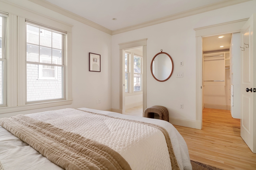 54 Orchard Street, Unit 1 Boston, MA 02130 - Photo 16 of 36 a bedroom with a bed and a large window
