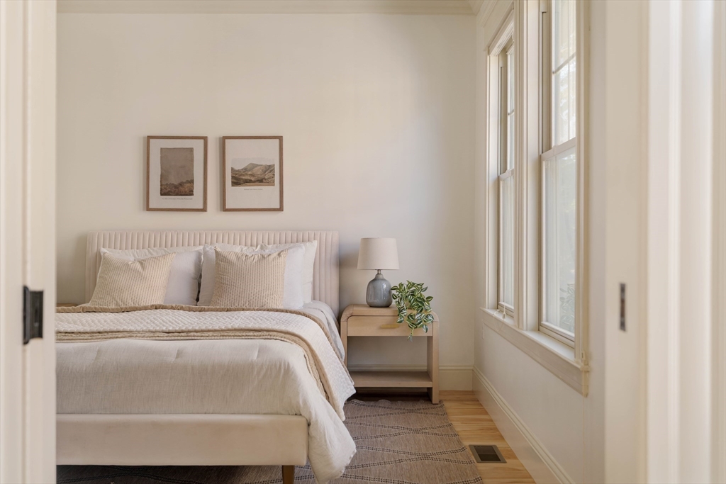 54 Orchard Street, Unit 1 Boston, MA 02130 - Photo 18 of 36 a bed room with a bed and a window