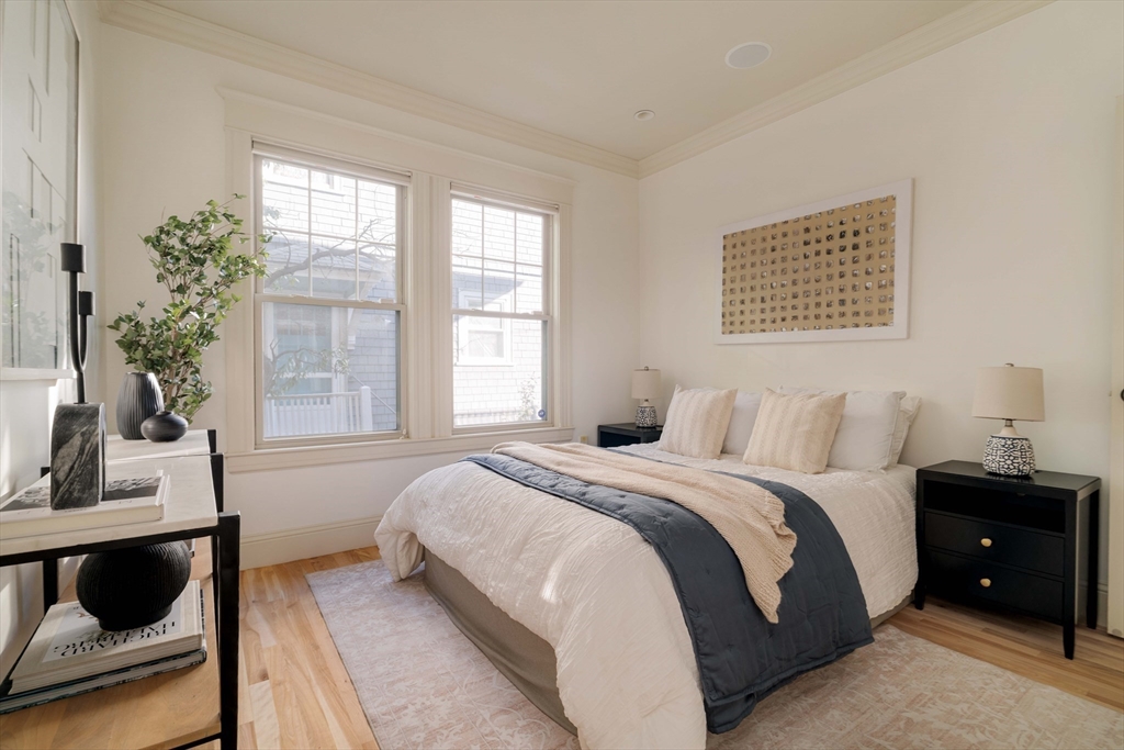 54 Orchard Street, Unit 1 Boston, MA 02130 - Photo 19 of 36 a bedroom with a bed and window