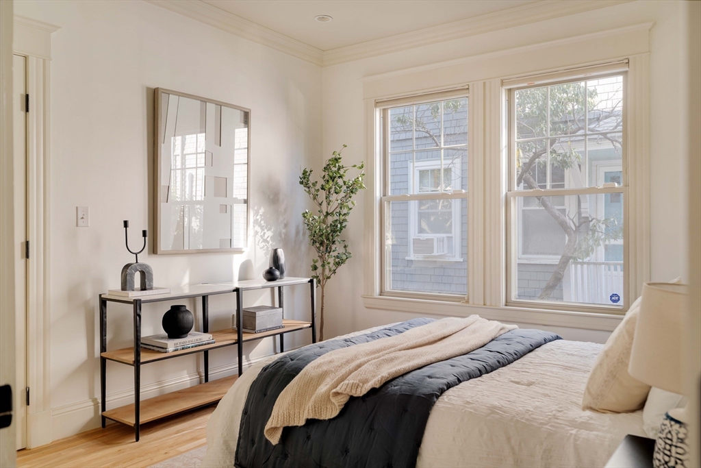 54 Orchard Street, Unit 1 Boston, MA 02130 - Photo 21 of 36 a bedroom with a bed and a window