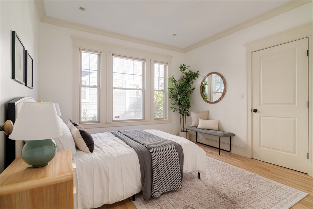 54 Orchard Street, Unit 1 Boston, MA 02130 - Photo 22 of 36 a bedroom with a large bed and a window