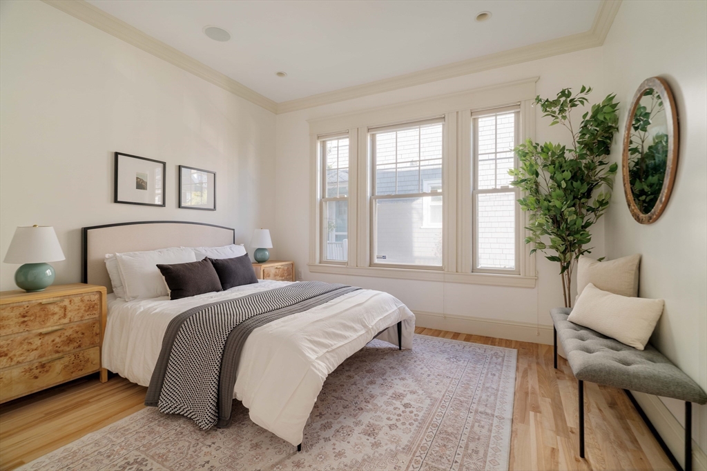 54 Orchard Street, Unit 1 Boston, MA 02130 - Photo 24 of 36 a bedroom with a large bed and a window