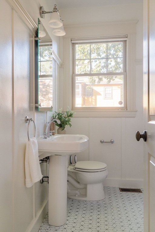 54 Orchard Street, Unit 1 Boston, MA 02130 - Photo 25 of 36 a bathroom with a sink toilet and window