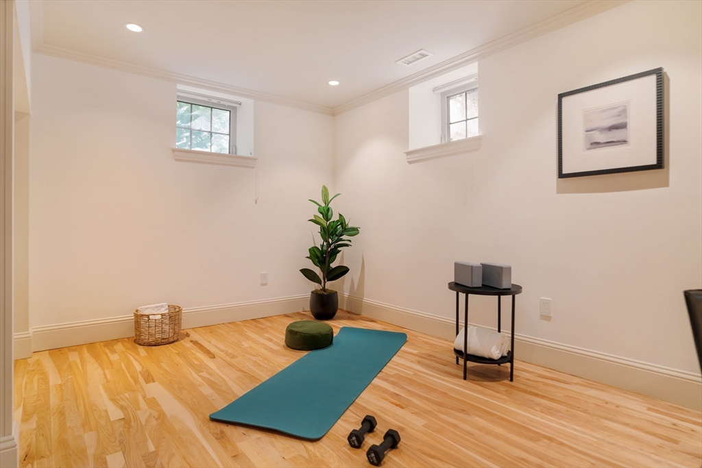 54 Orchard Street, Unit 1 Boston, MA 02130 - Photo 27 of 36 a view of a room with wooden floor and lounge chair