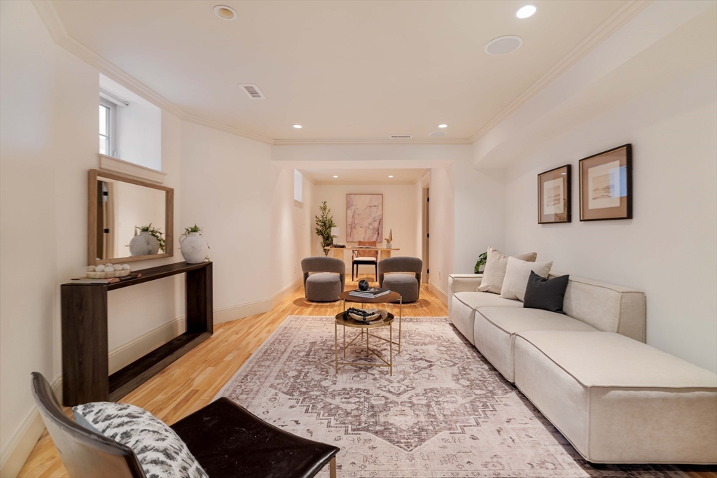 54 Orchard Street, Unit 1 Boston, MA 02130 - Photo 28 of 36 a living room with furniture and a couch