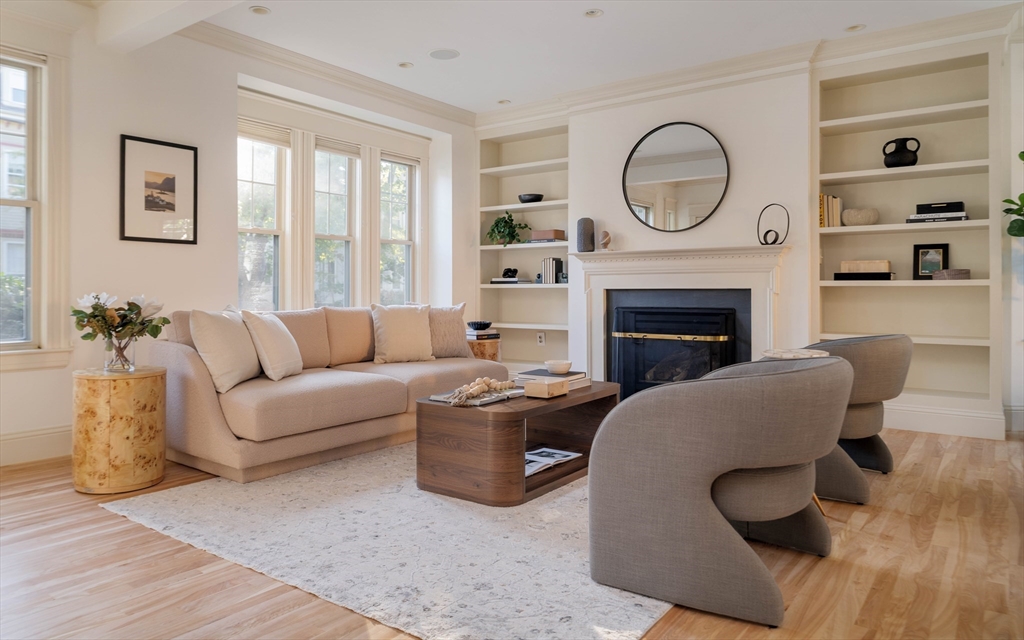 54 Orchard Street, Unit 1 Boston, MA 02130 - Photo 4 of 36 a living room with furniture a fireplace and a large window