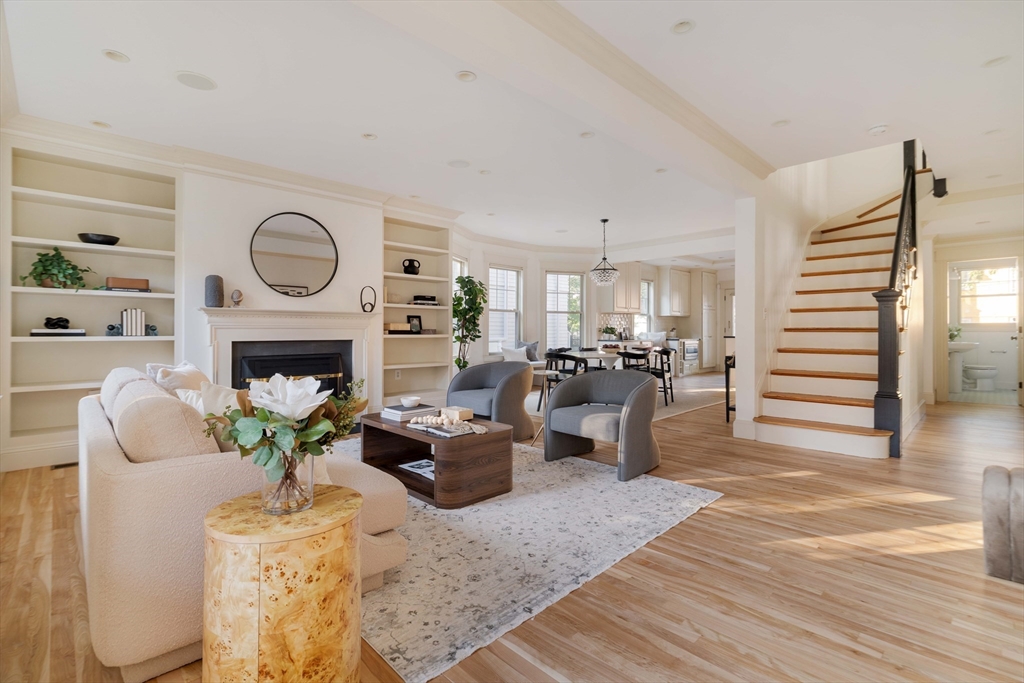 54 Orchard Street, Unit 1 Boston, MA 02130 - Photo 5 of 36 a living room with furniture a fireplace and a table