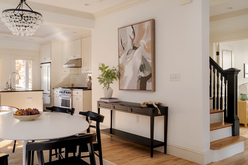 54 Orchard Street, Unit 1 Boston, MA 02130 - Photo 8 of 36 a view of a dining room with furniture and wooden floor