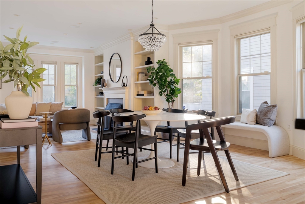 54 Orchard Street, Unit 1 Boston, MA 02130 - Photo 9 of 36 a view of a dining room with furniture window and wooden floor