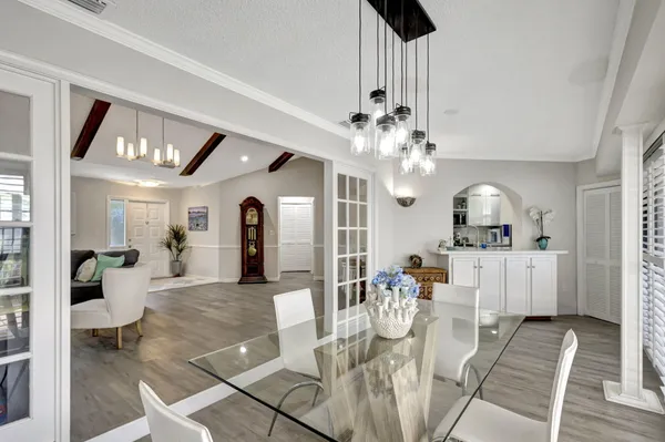 a bedroom with a bed and a large window with the outer view