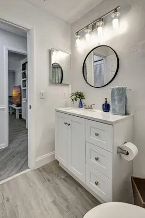 a bedroom with a bed furniture and a flat screen tv