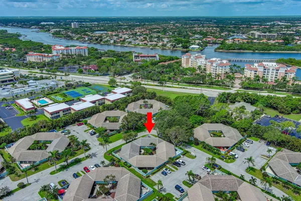 an aerial view of residential houses with outdoor space