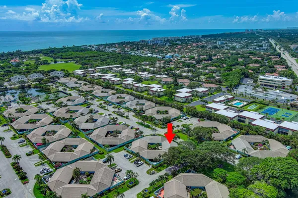 an aerial view of residential houses with outdoor space