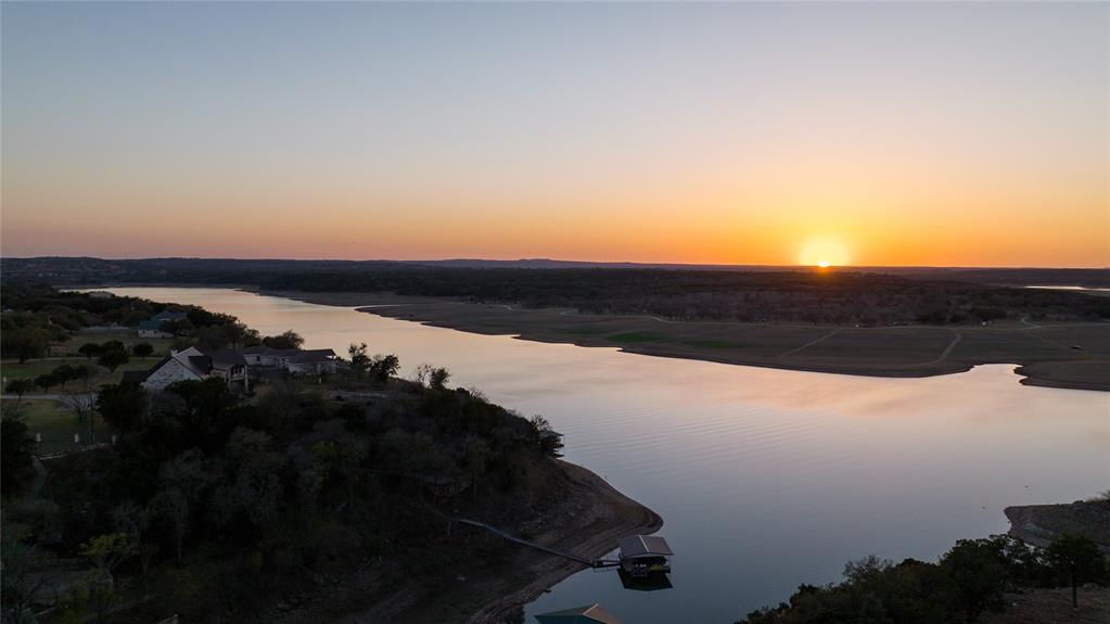 5255 Lookout Ridge Drive Marble Falls, TX 78654 - Photo 11 of 40 Aerial of sunset at Lake Travis along Lookout Ridge;
our cove center bottom