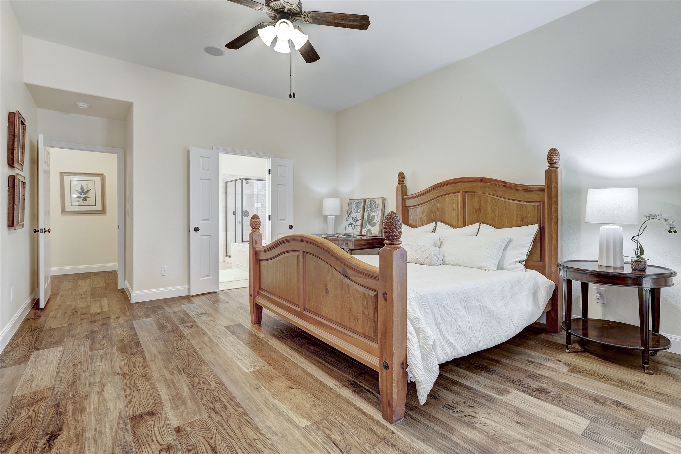 3600 Alexandrite Way Round Rock, TX 78681 - Photo 17 of 40 a spacious bedroom with a bed and a chandelier