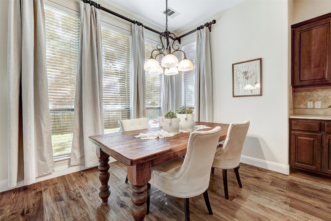 3600 Alexandrite Way Round Rock, TX 78681 - Photo 18 of 40 a view of a dining room with furniture window and wooden floor