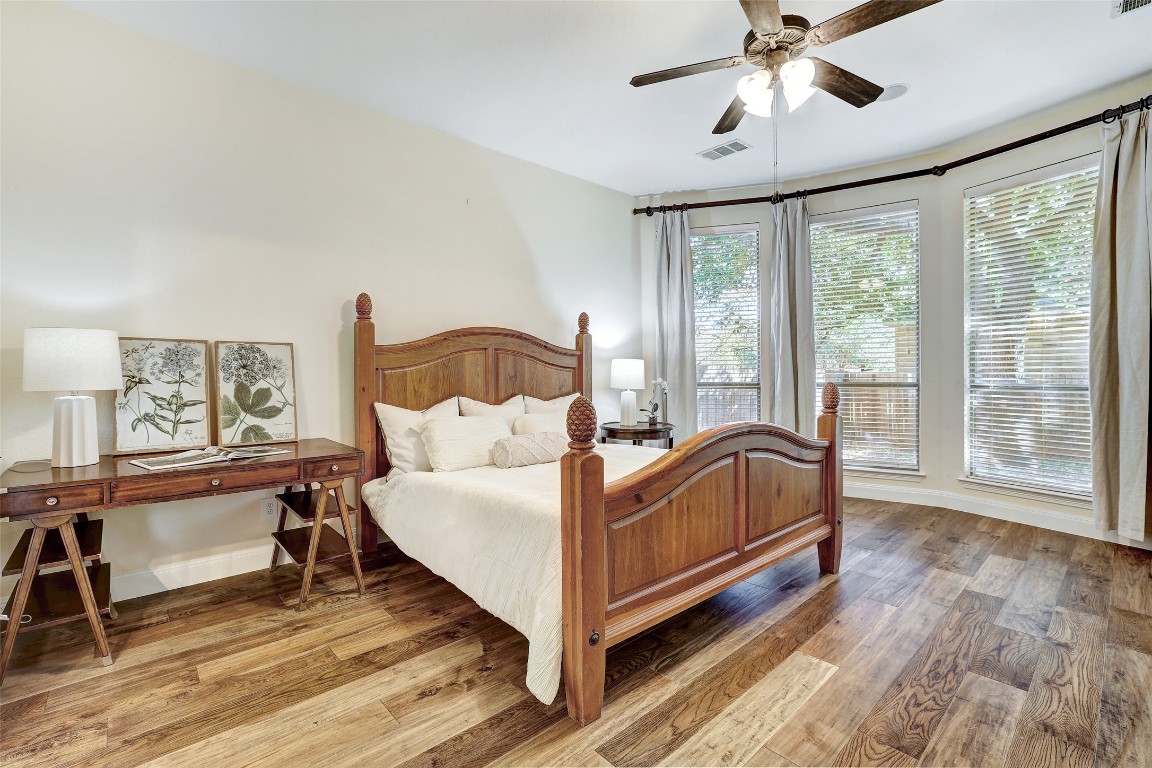 3600 Alexandrite Way Round Rock, TX 78681 - Photo 20 of 40 a view of a bedroom with a bed and wooden floor