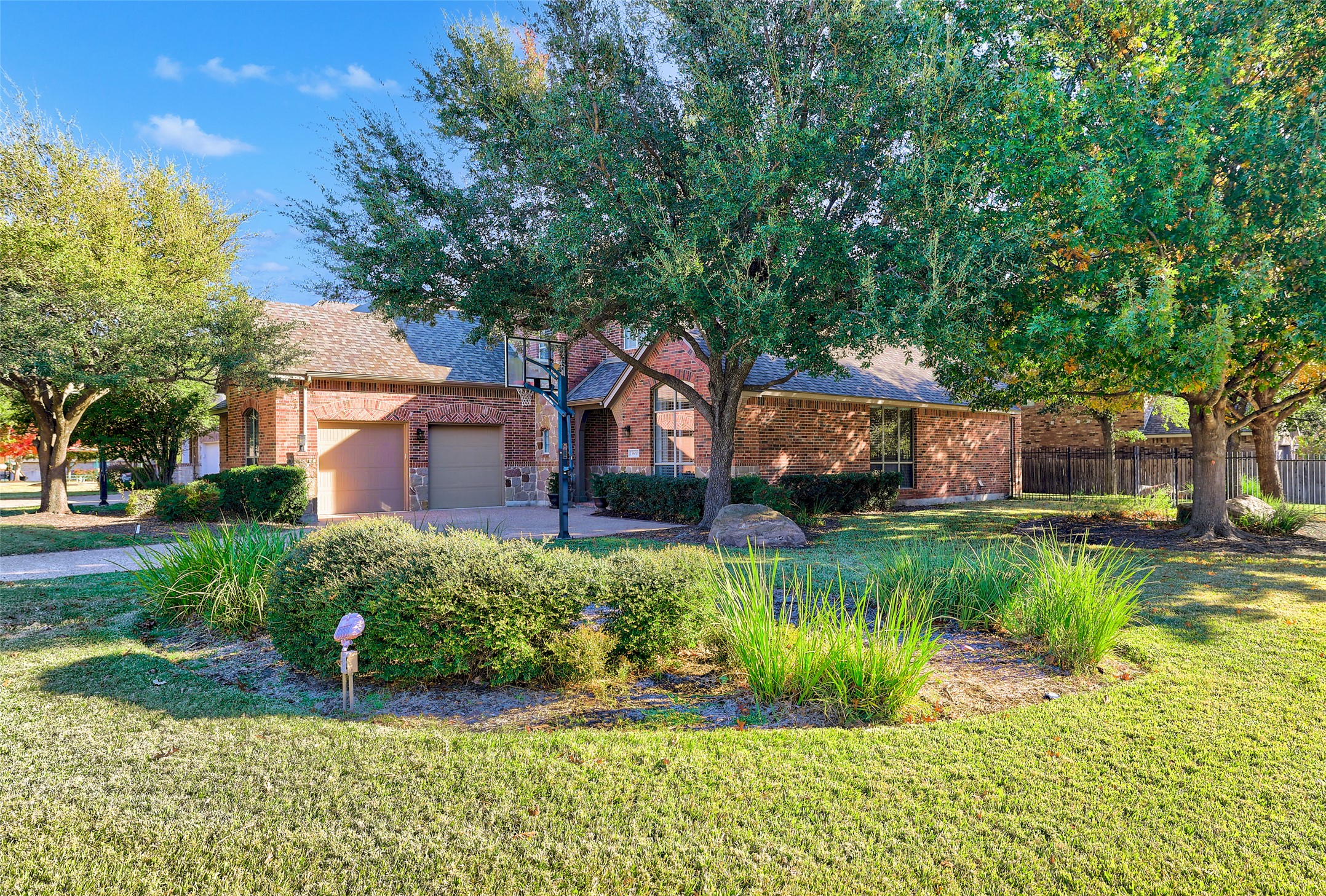 3600 Alexandrite Way Round Rock, TX 78681 - Photo 2 of 40 a front view of a house with a yard and a garden