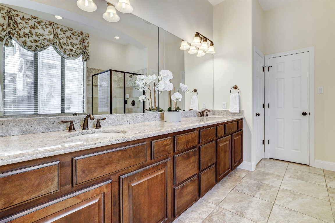 3600 Alexandrite Way Round Rock, TX 78681 - Photo 22 of 40 a spacious bathroom with a granite countertop double vanity sink mirror and