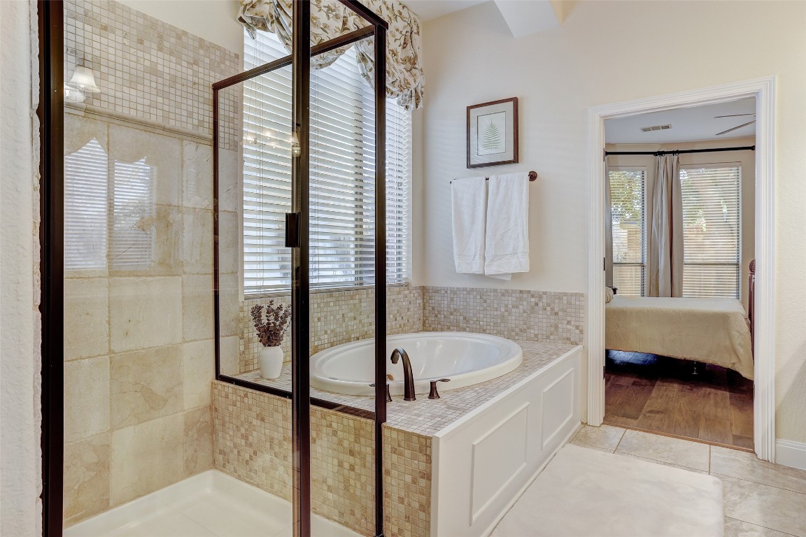 3600 Alexandrite Way Round Rock, TX 78681 - Photo 24 of 40 a bathroom with a tub and a shower