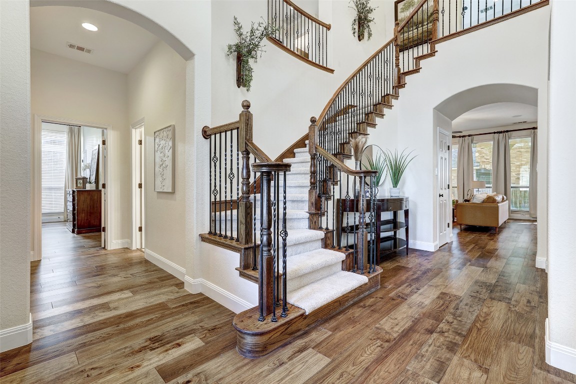 3600 Alexandrite Way Round Rock, TX 78681 - Photo 3 of 40 a view of a hallway with wooden floor staircase and livingroom