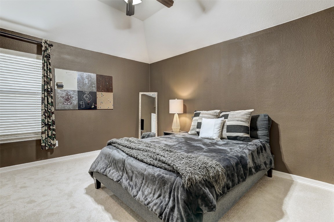 3600 Alexandrite Way Round Rock, TX 78681 - Photo 32 of 40 a bedroom with a bed and wooden floor