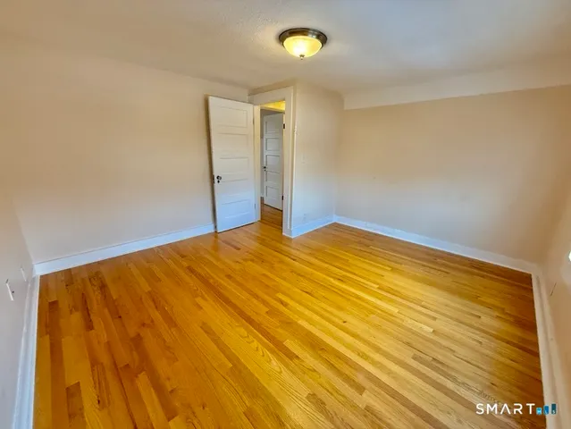 a balcony with wooden floor