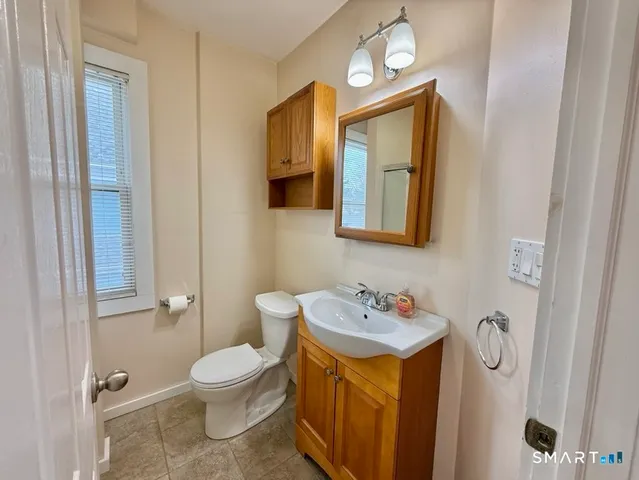 a bathroom with a tub and a sink