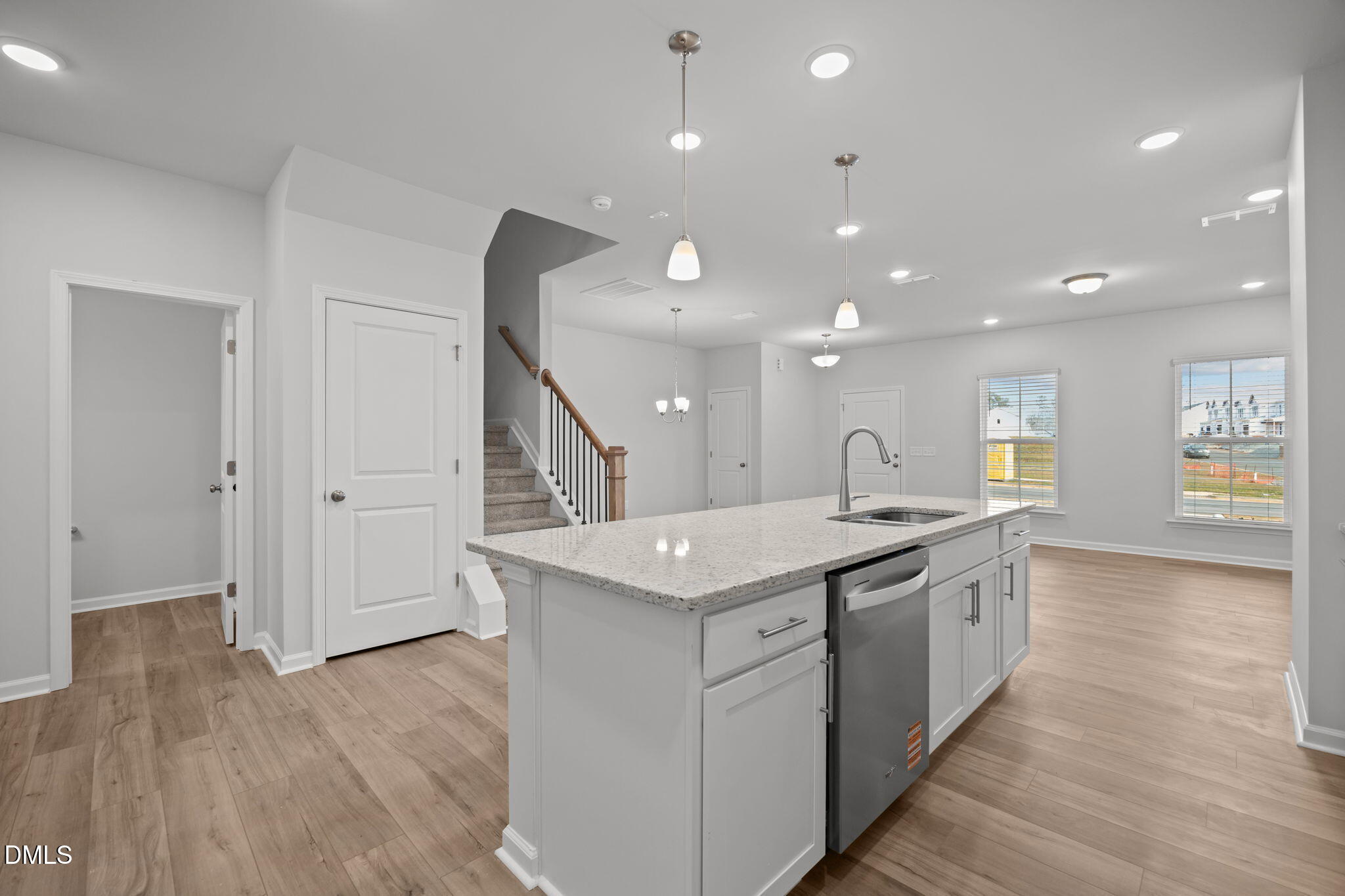 272 Fosterton Cottage Way Raleigh, NC 27603 - Photo 27 of 35 a kitchen with a sink and wooden floor