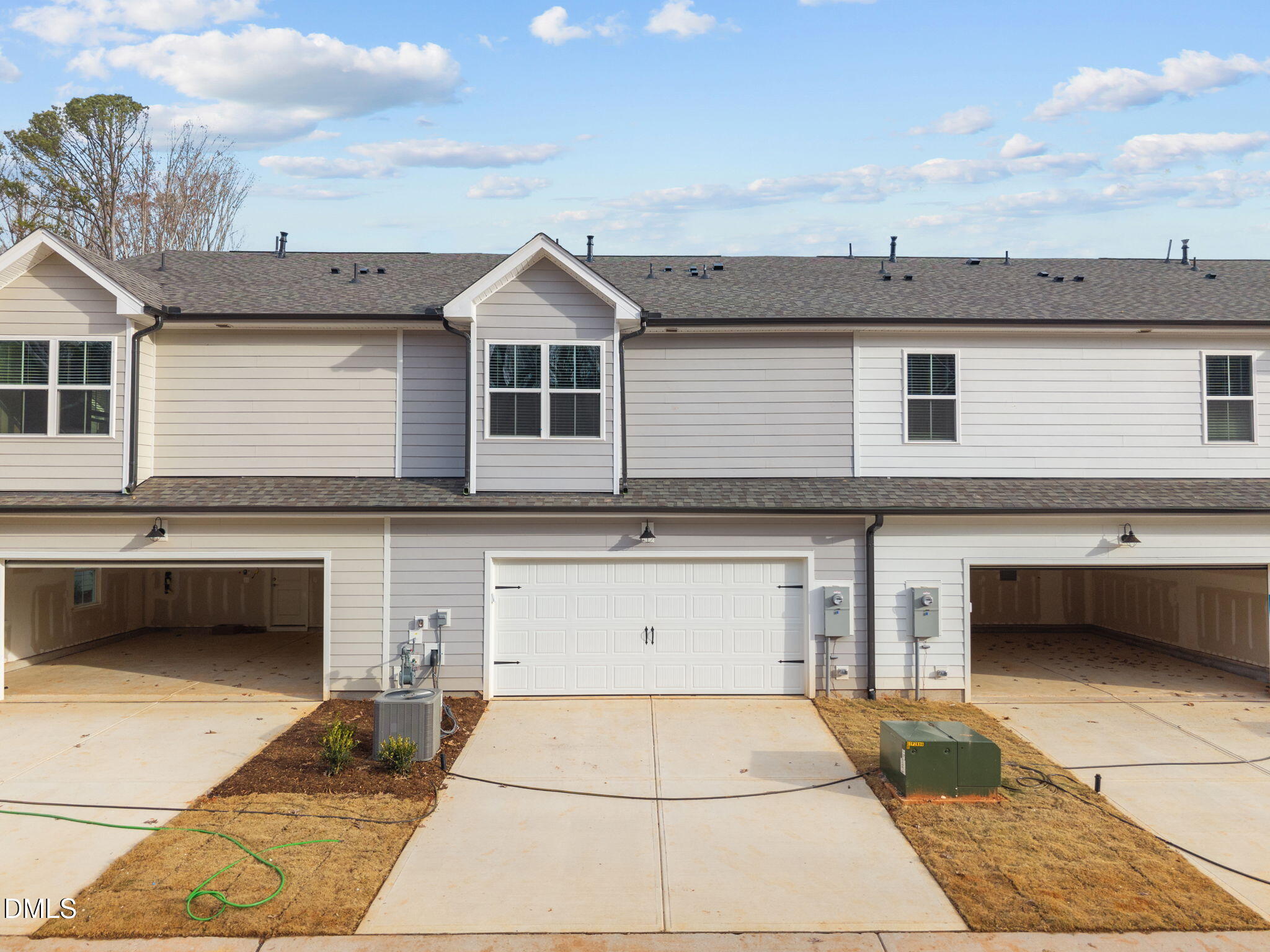272 Fosterton Cottage Way Raleigh, NC 27603 - Photo 3 of 35 a front view of a house with a garage