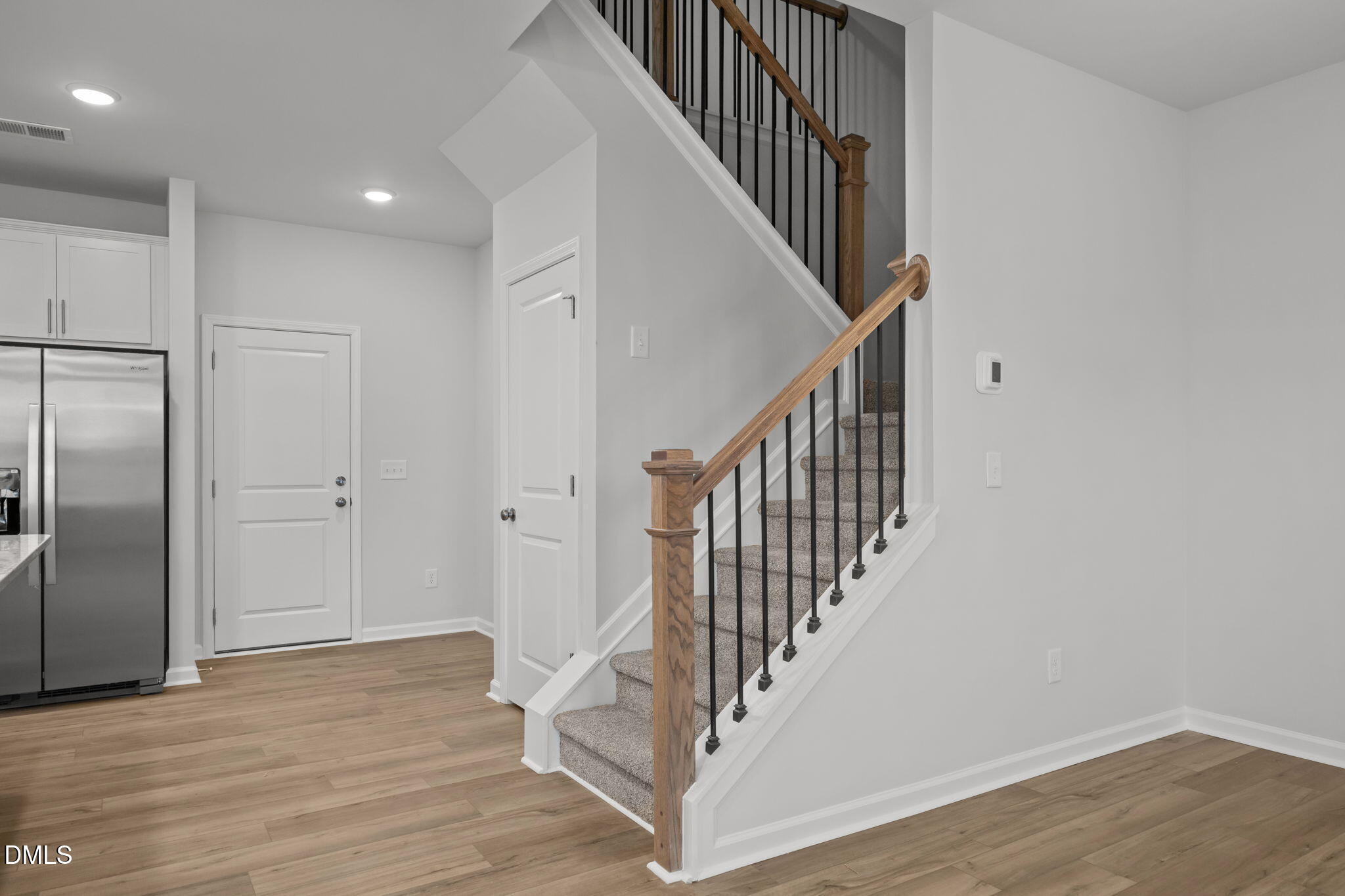 272 Fosterton Cottage Way Raleigh, NC 27603 - Photo 31 of 35 a view of staircase with wooden floor and white walls