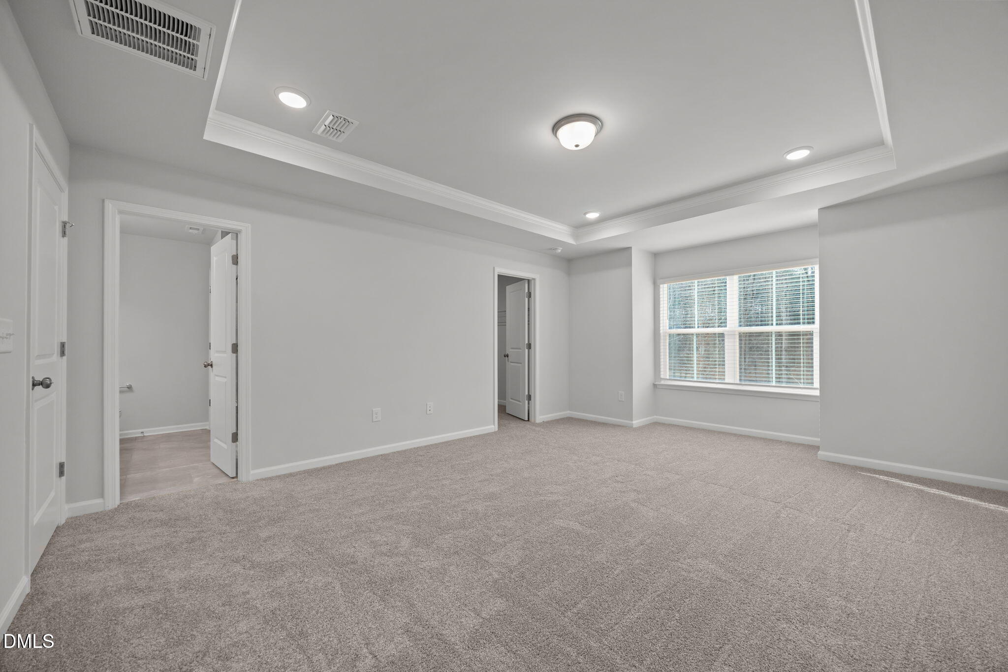 272 Fosterton Cottage Way Raleigh, NC 27603 - Photo 8 of 35 an empty room with windows