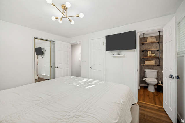 1215 8th Street Ogden, UT 84404 - Photo 14 of 39 Bright bedroom featuring a contemporary brass chandelier