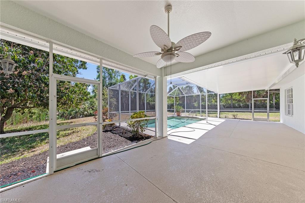 9623 Springlake Circle Estero, FL 33928 - Photo 37 of 47 a view of an empty room with a floor to ceiling windows and pool table