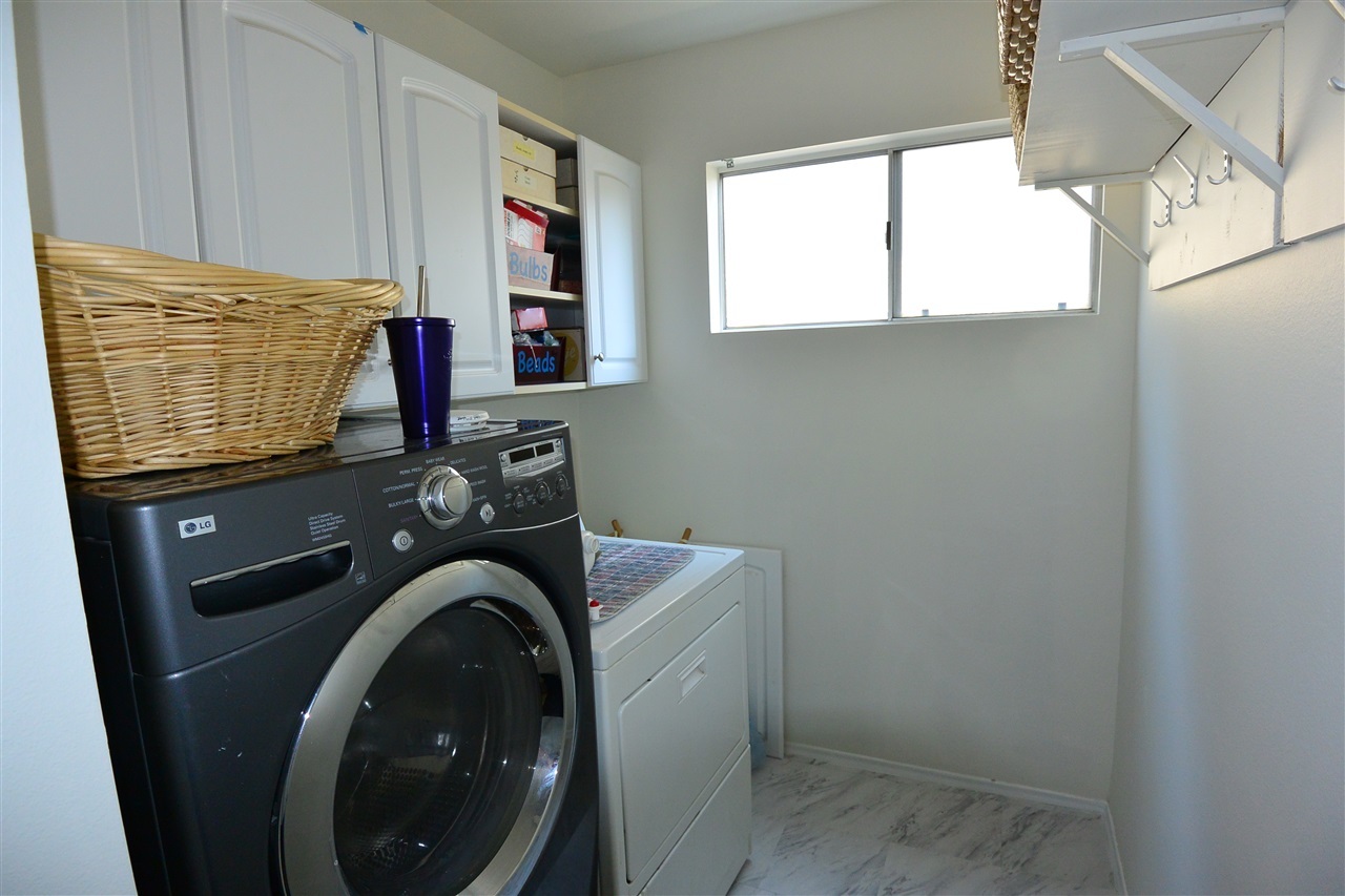 10366 Moorpark Street Spring Valley, CA 91978 - Photo 13 of 25 SEPARATE LAUNDRY ROOM WITH CABINETS