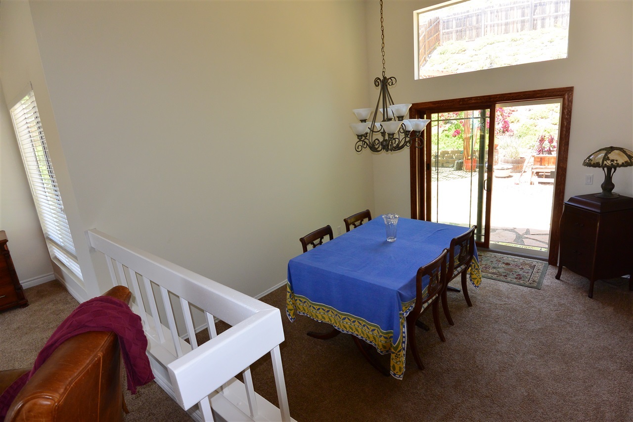 10366 Moorpark Street Spring Valley, CA 91978 - Photo 4 of 25 FORMAL DINING ROOM WITH WOOD CASED SLIDING GLASS DOORS LEADING INTO BACK YARD