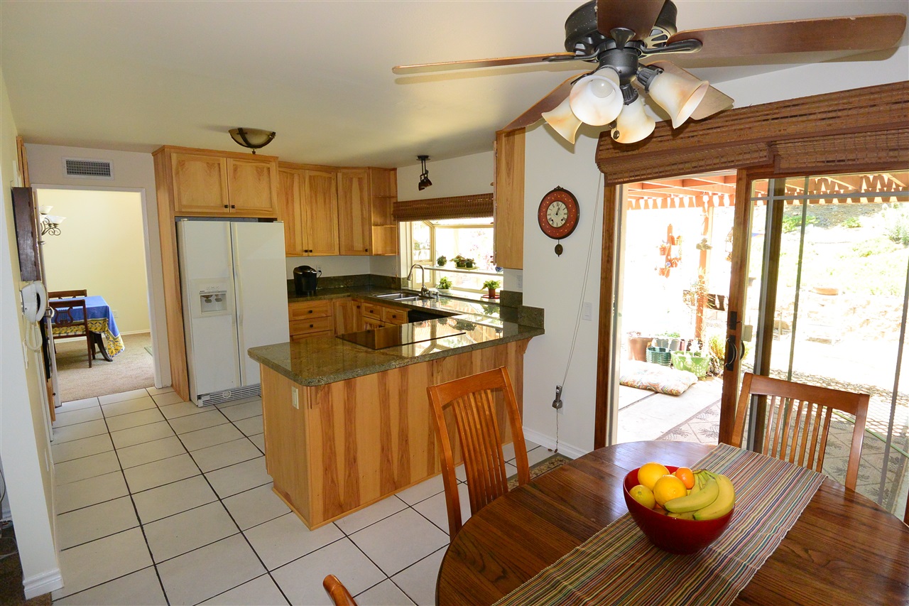 10366 Moorpark Street Spring Valley, CA 91978 - Photo 6 of 25 OPEN KITCHEN LEADS INTO BREAKFAST NOOK AND FAMILY ROOM
