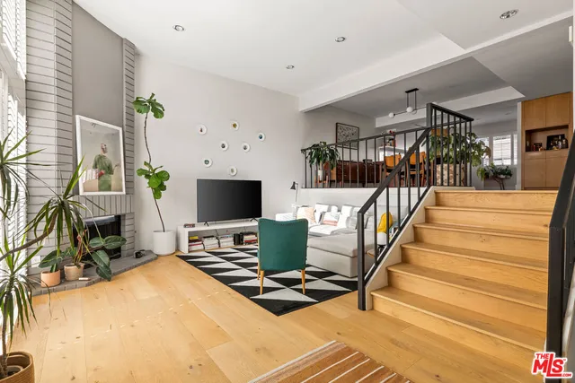 a room with furniture and a flat screen tv