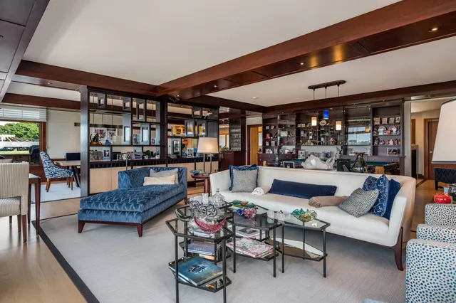 a living room filled with furniture and a table