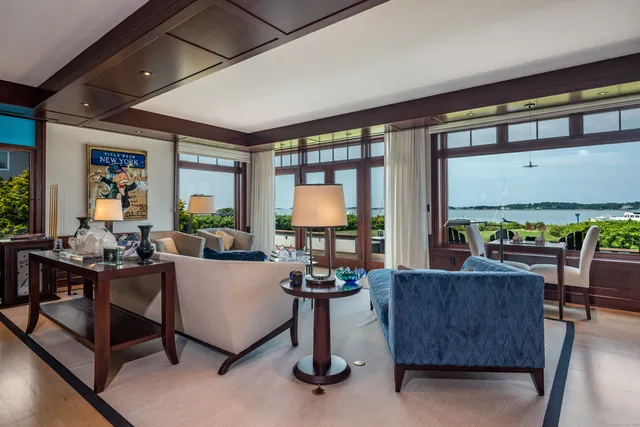 a kitchen with stainless steel appliances kitchen island granite countertop a table and chairs