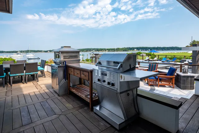an aerial view of a house with a swimming pool yard and outdoor seating