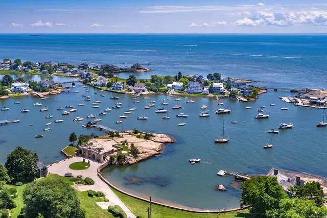 an aerial view of a swimming pool and mountain