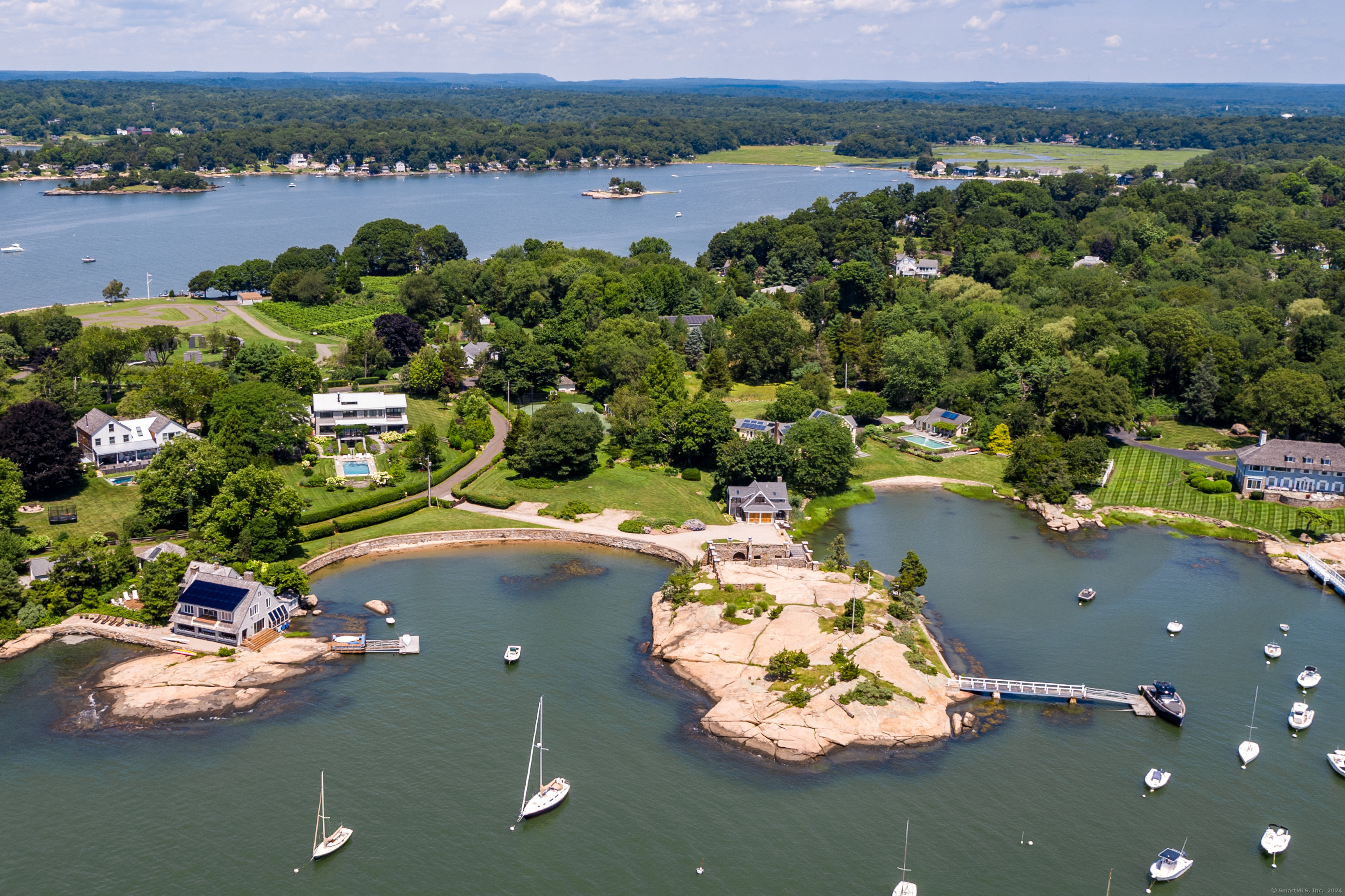 215 Uncas Point Road Guilford, CT 06437 - Photo 31 of 40 an aerial view of a house with a lake view
