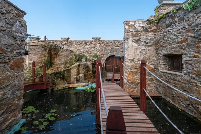 an aerial view of a house with a backyard