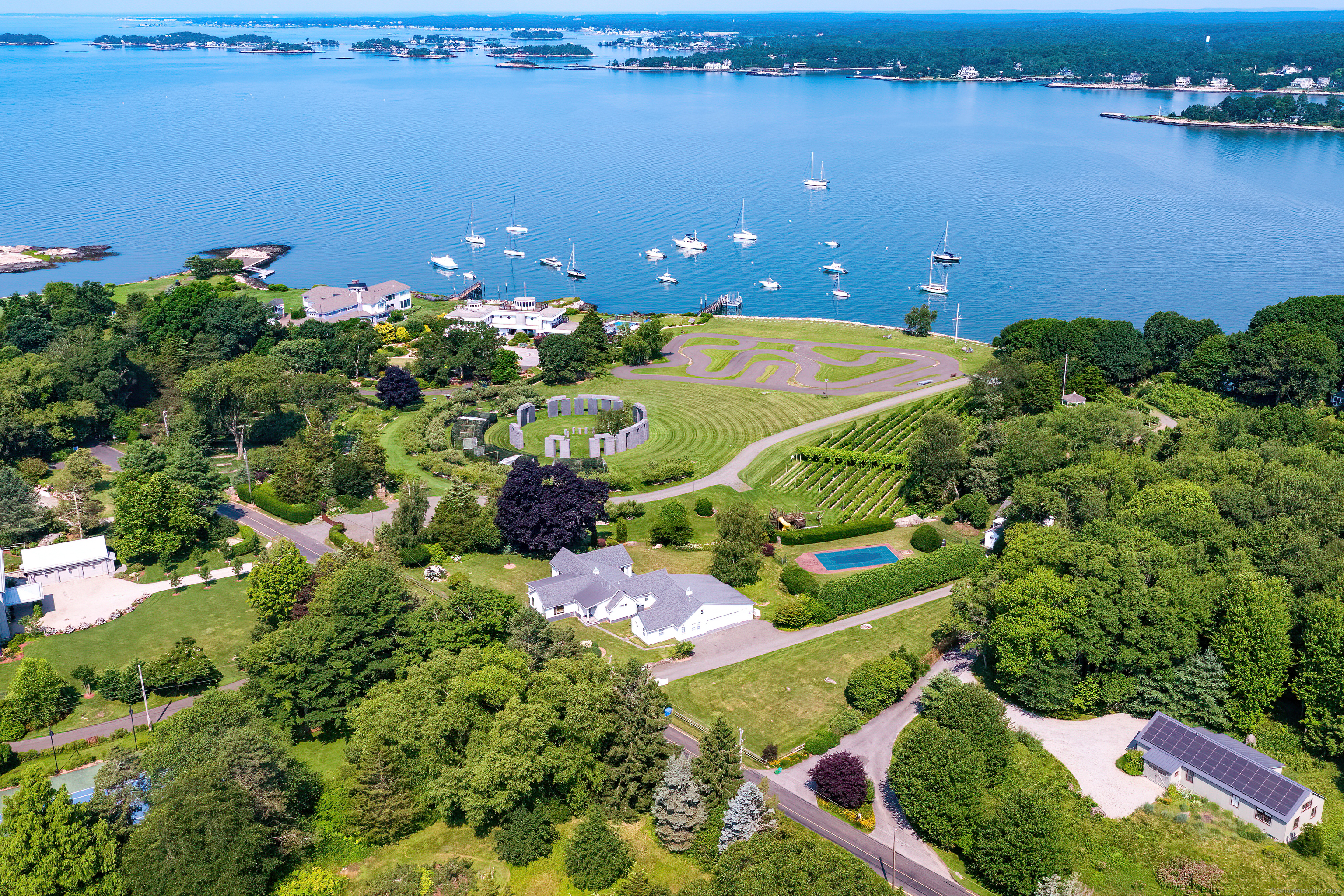 215 Uncas Point Road Guilford, CT 06437 - Photo 37 of 40 a view of a houses with yard and lake view