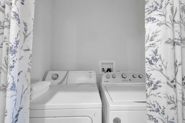 a en suite bathroom with a sink double vanity and a mirror