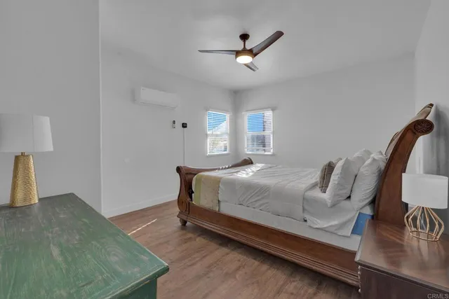 a kitchen with stainless steel appliances a sink cabinets and wooden floor